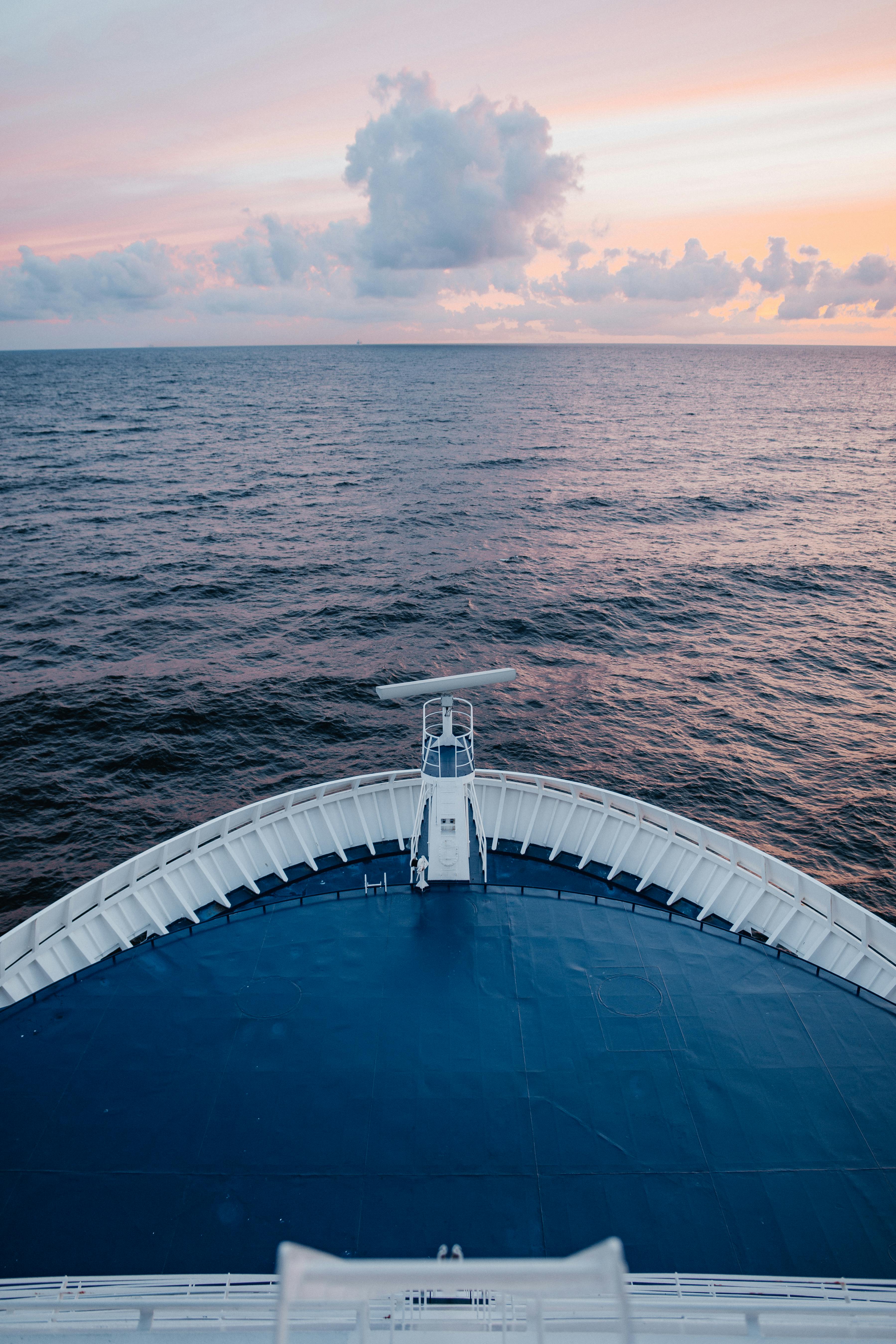 Ship bow looking out at calm ocean at dawn