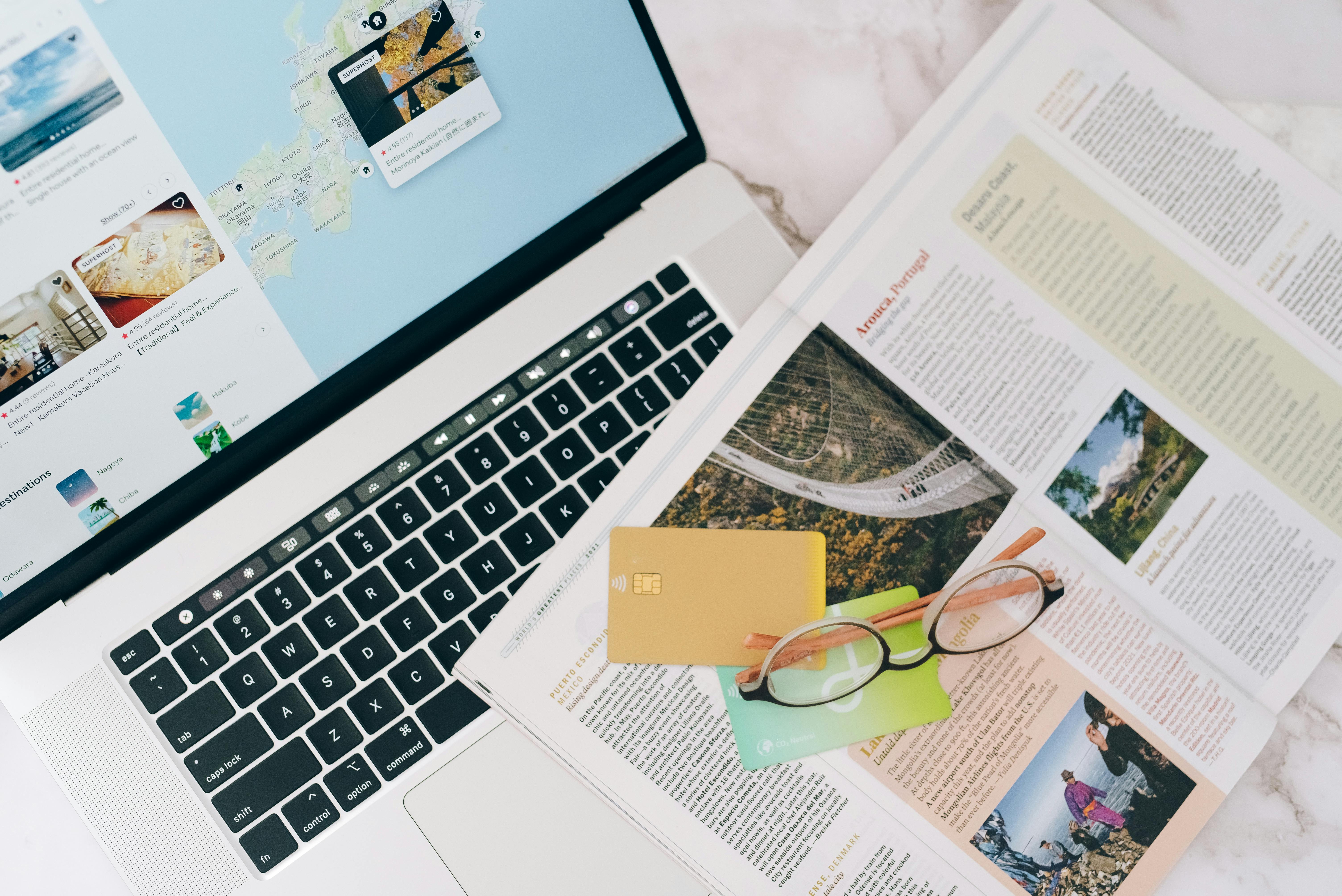 Laptop showing OTA booking platform with travel credit card